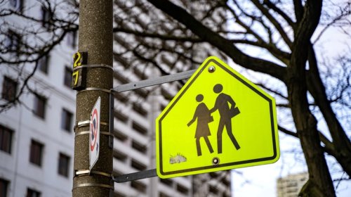 Why School Zone Signs Use That Specific Loud, Glowing, Fluorescent Yellow-Green Hue
