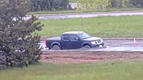 Pickup Truck Driver Moves 'Road Closed' Sign, Immediately Gets Stuck In Wet Concrete