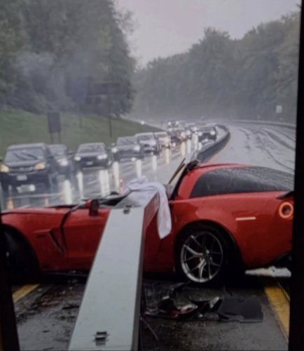 Corvette Z06 Torn Apart by Guardrail in Rain Crash as Driver Somehow Walks Away From the Wreck