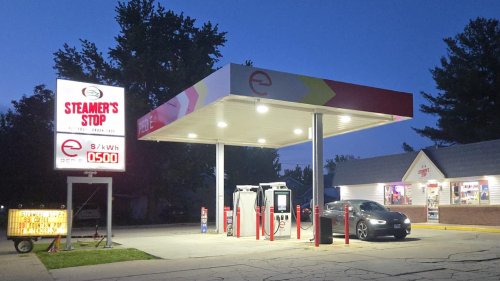 EV driver finds first all-electric charging station complete with a convenience store and giant price sign