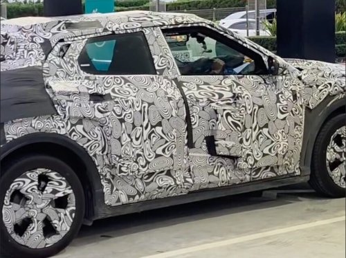 Perodua ‘QV-E’ EV spotted without rear wing, exposing sloping roofline, notched tailgate design, sporty profile