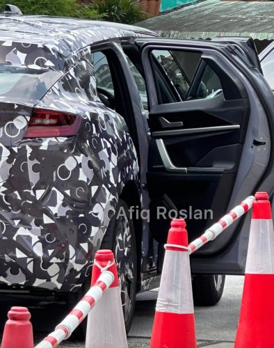 Perodua ‘QV-E’ EV spied again in Malaysia – sloping roofline, small side window revealed; debut in Q4 2025