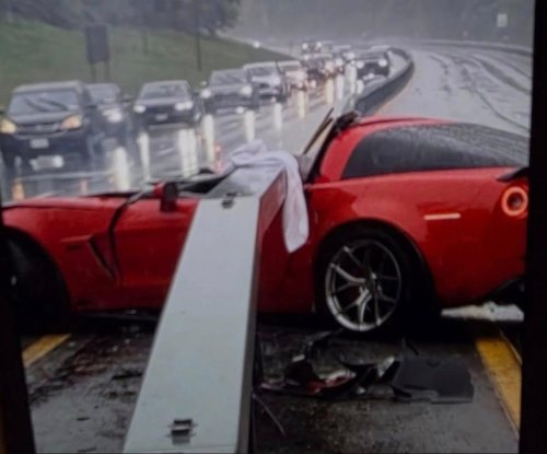 C6 Corvette Z06 Driver Survives Guardrail Smashing Through Cabin in Rainy Highway Crash