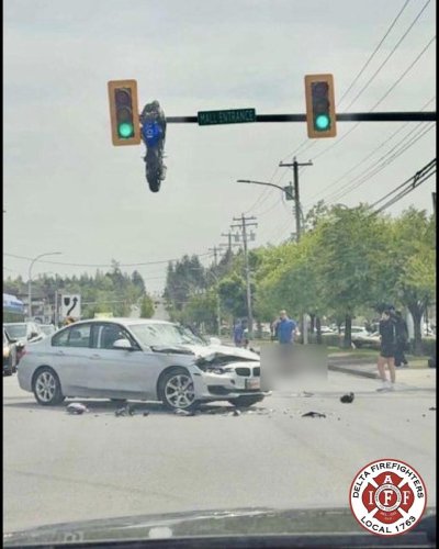 Crash Leaves Sportbike Hanging From Traffic Light in Accidental Trick-Shot Parking Job