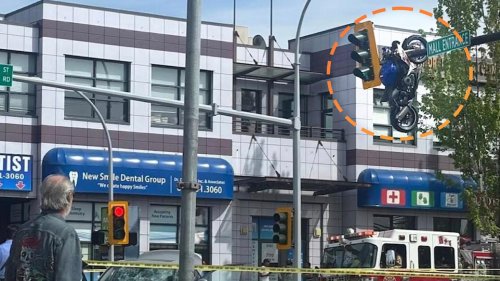 Crash Leaves Sportbike Hanging From Traffic Light in Accidental Trick-Shot Parking Job