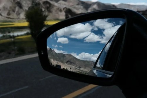 The Little Tab Under Your Rearview Mirror Most Drivers Never Use