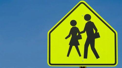 Why School Zone Signs Use That Specific Loud, Glowing, Fluorescent Yellow-Green Hue