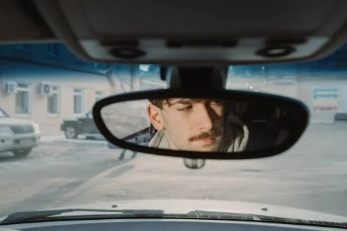 The Little Tab Under Your Rearview Mirror Most Drivers Never Use