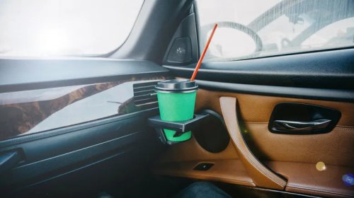 This May Be What The Gap In Between Your Car's Cup Holders Is Actually For