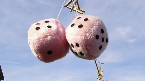 Why Those Fuzzy-Dice Hanging From The Review Mirror Have Nearly Disappeared