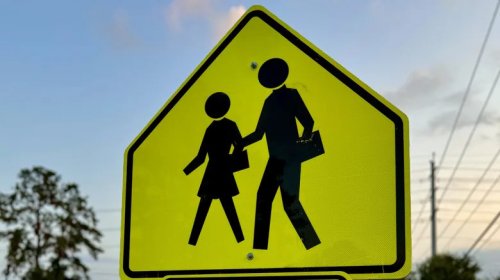 Why School Zone Signs Use That Specific Loud, Glowing, Fluorescent Yellow-Green Hue