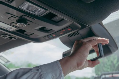 The Little Tab Under Your Rearview Mirror Most Drivers Never Use