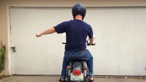 What Does It Mean When A Biker Puts Their Left Fist Out And Moves It Up And Down?