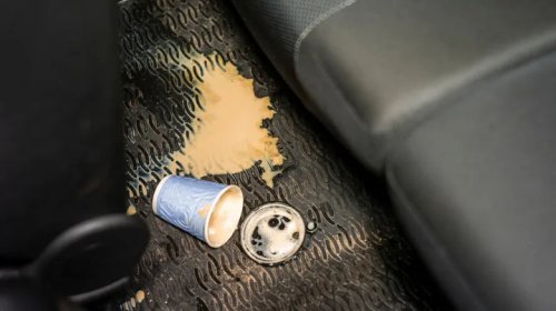 This May Be What The Gap In Between Your Car's Cup Holders Is Actually For