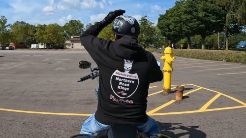 What Does It Mean When A Biker Puts Their Left Fist Out And Moves It Up And Down?