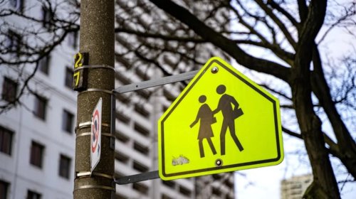Why School Zone Signs Use That Specific Loud, Glowing, Fluorescent Yellow-Green Hue