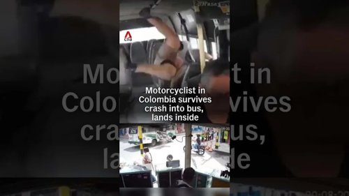 Watch a Motorcyclist Crash Into an Open City Bus Door and Catch a Ride