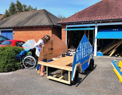 He Turned a Dumpster Into a Drivable Fake Cybertruck and Camped Outside a Tesla Dealership