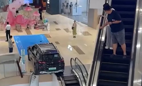 Customer Reverses Mercedes SUV Through Mall Railing, Nearly Falling Onto Ice Cream Shop