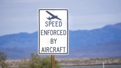 What Those 'Speed Enforced By Aircraft' Signs Are Really For