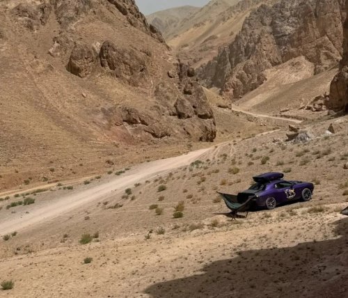 Dodge, Dodge Challenger, Man Showers at an F1 Circuit Using a Dodge Challenger's Trunk — There's Also a Stove on the Hood
