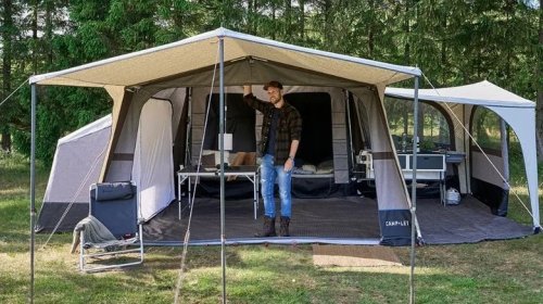 This Tiny Travel Trailer Is Hiding An Entire 10-Person Home On The Go