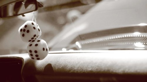Why Those Fuzzy-Dice Hanging From The Review Mirror Have Nearly Disappeared