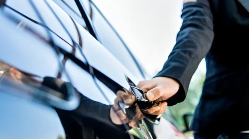 Here's What That Small Button On Your Car Door Handle Is For