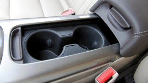 This May Be What The Gap In Between Your Car's Cup Holders Is Actually For
