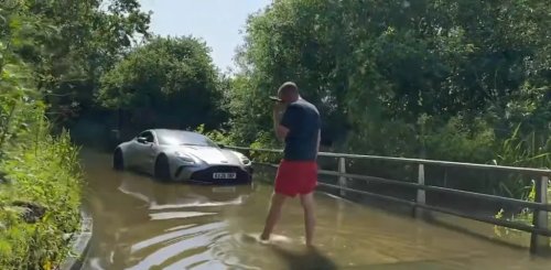 Aston Martin, SUV, Driver Learns an Expensive Lesson After Aston Martin Vantage Takes on Flooded Road Like an SUV