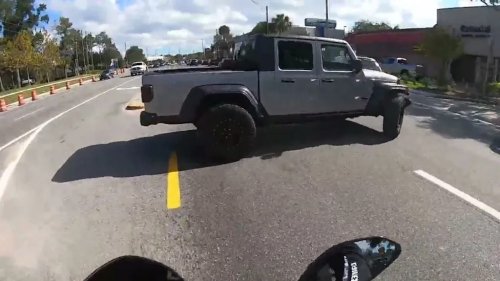 Dashcam Shows a Jeep Pulling Out Into an Intersection, Nearly Taking Out a Biker