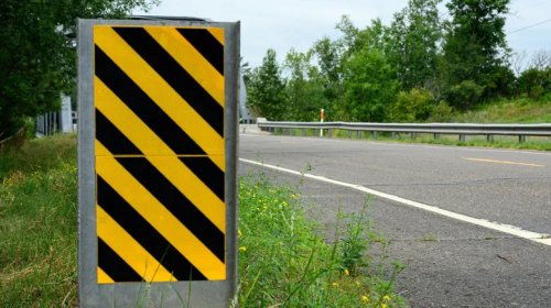 Here's What Those Diagonal Black And Yellow Striped Road Signs Are Telling You