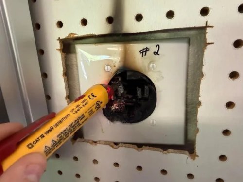 Electrician inspects melted EV charger outlet, says cheap 50-amp receptacles take the blame