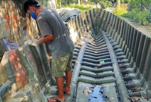 He Built a Full-Size Boat in His Yard—and Powered It With a Custom Hybrid Car Engine
