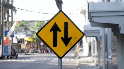What Does A Road Sign With Two Arrows Mean? (One Pointing Up, The Other Down)