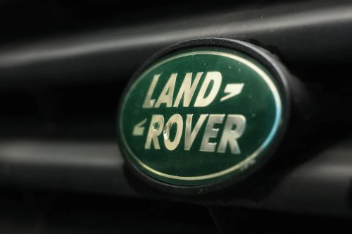 Land Rover's Putting A Dakar Race Truck, A Rare '90s Defender, And A Mystery Reveal On The Same Lawn At The Quail